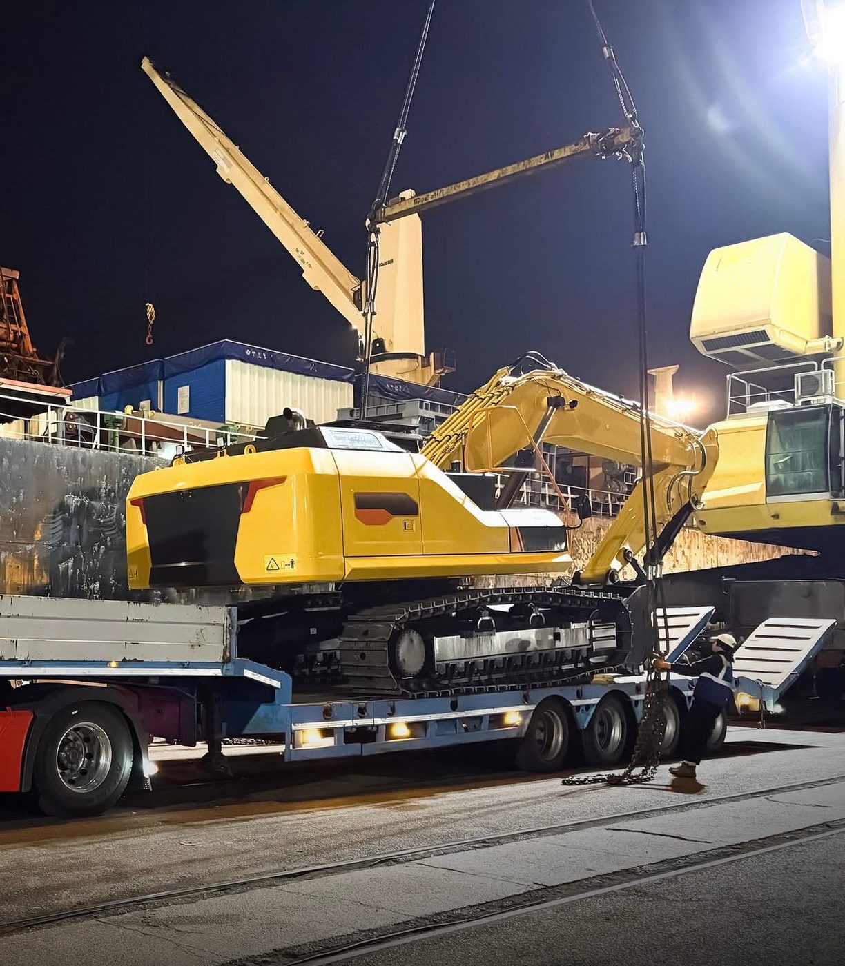 Excavator loaded onto a lowbed